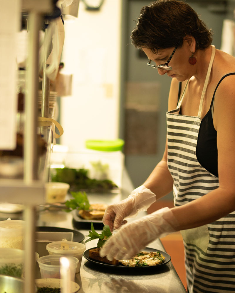 Woman prepairing food | AlbergoAllegria breakfast restaurant | Catskills, New York